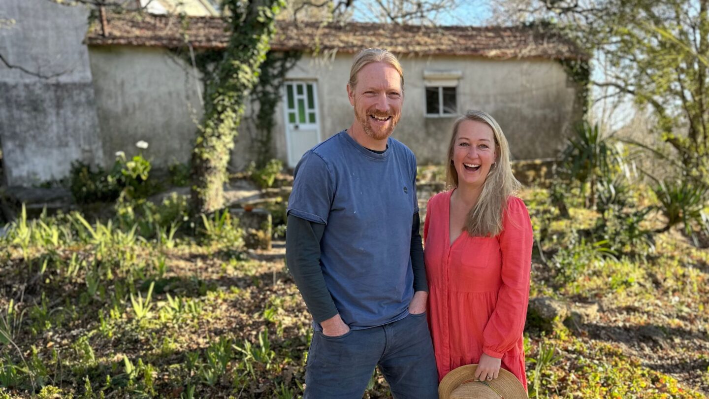 John and Tara standing in front of the farmhouse at their farm in Northern Portugal.