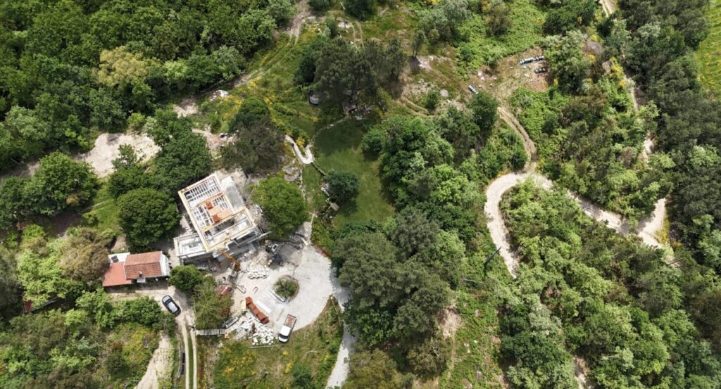Figure 4. The Newbys farm from above, stone house mid-build